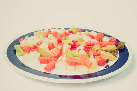 Vintage looking Mixed vegetables as used in Russian Salad including carrots turnips courgettes zucchini cauliflower peppers celery onionsの写真素材