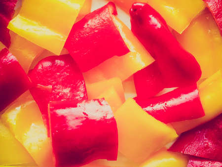 Vintage looking Red and yellow peppers useful as a food background