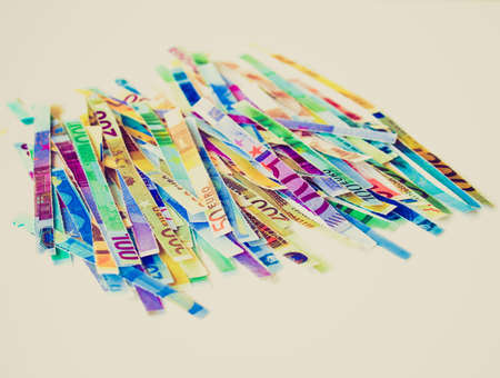 Vintage looking Money to burn - banknotes cut with a paper shredderの写真素材