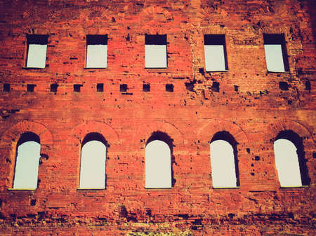 Vintage looking Torri Palatine ancient Roman gates in Turin Italyの写真素材
