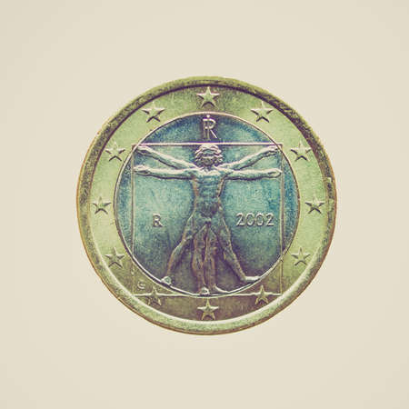 Vintage looking Italian One Euro coin isolated over a white backgroundの写真素材