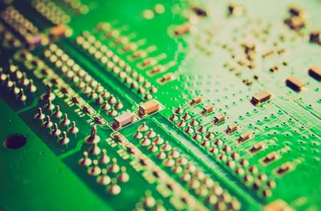 Vintage looking Detail of an electronic printed circuit board - selective focusの写真素材
