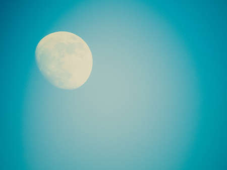 Vintage looking Full moon over the blue sky - with copyspace