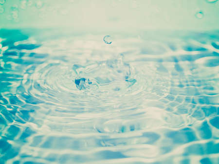 Vintage looking Close-up macro of a water drop dropletの写真素材