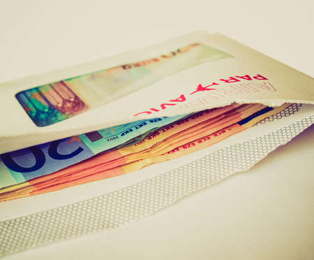 Vintage looking Euro banknotes money in an envelopeの写真素材