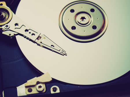 Vintage looking Detail of a magnetic computer hard diskの写真素材