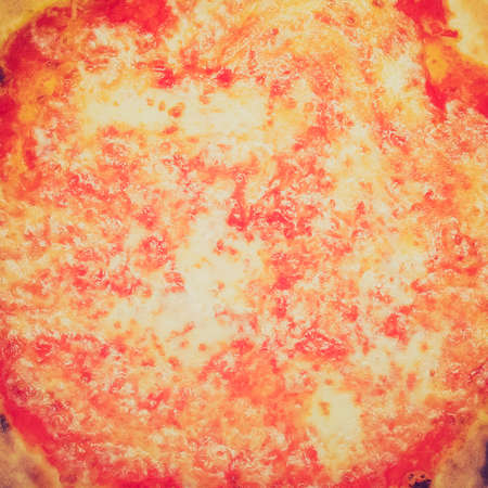 Vintage looking Italian Pizza Margherita (Margarita) with tomato and Mozzarella cheese -  backgroundの写真素材