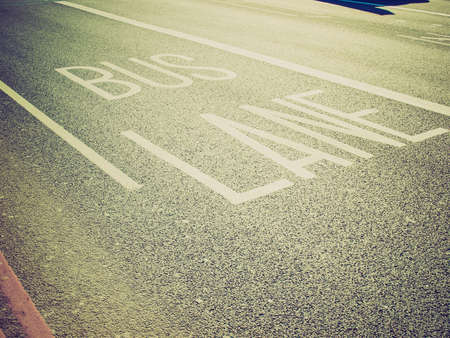 Vintage looking Bus lane traffic signs on a streetの写真素材
