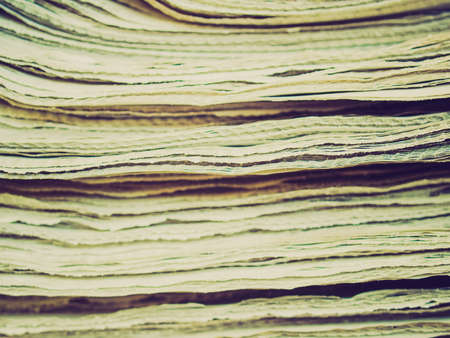 Vintage looking Detail of a stack pile of newspapersの写真素材