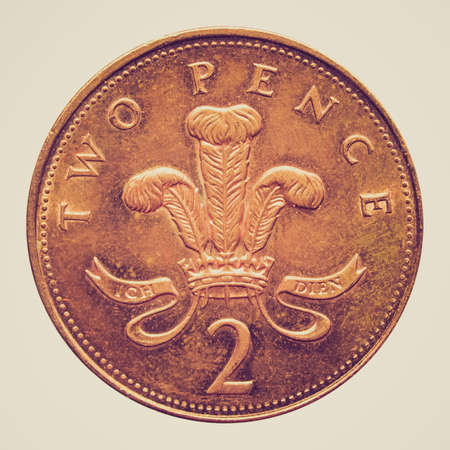 Vintage looking Two Pence coin isolated over white backgroundの写真素材