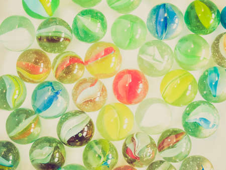 Vintage looking Coloured glass marble spheres toy background pattern