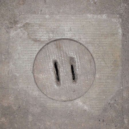 Detail of a manhole in the streetの写真素材