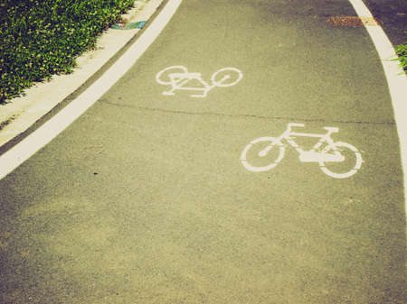 Vintage looking Stencil bike sign in black over whiteの写真素材