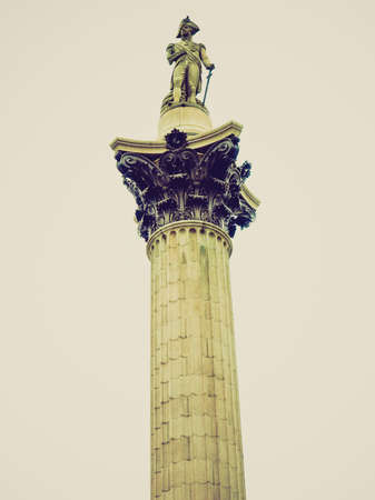 Vintage looking Nelson Column monument in Trafalgar Square London UK - isolated over white backgroundの写真素材