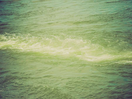 Vintage looking Blue sea water useful as a backgroundの写真素材