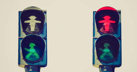 Vintage looking East Germany Ampelmann traffic lights in Berlin - isolated over white backgroundのeditorial素材
