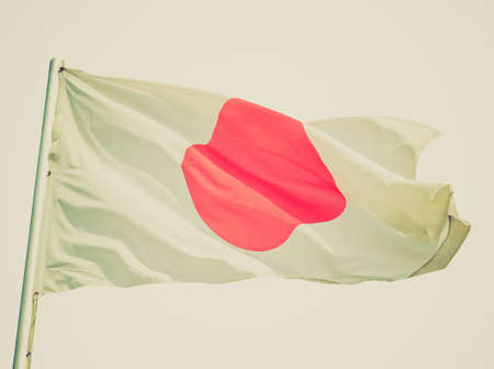 Vintage retro looking The national Japanese flag of Japan (JP) - isolated over white background
