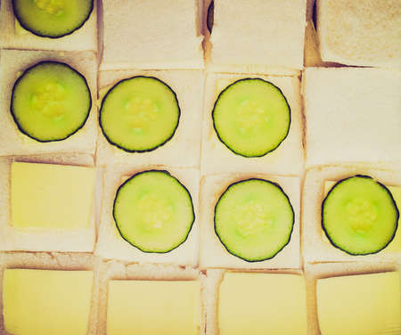Vintage looking Traditional British cucumber sandwich with butter and breadの写真素材