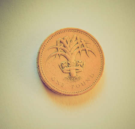 Vintage looking Macro image of British pound coins moneyの写真素材