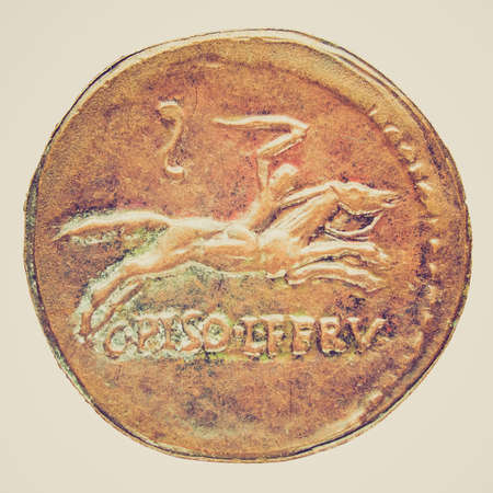 Vintage looking Ancient Roman coin isolated over white backgroundの写真素材