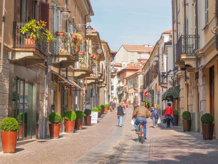 RIVOLI, ITALY - APRIL 09, 2014: People visiting the old town city centre