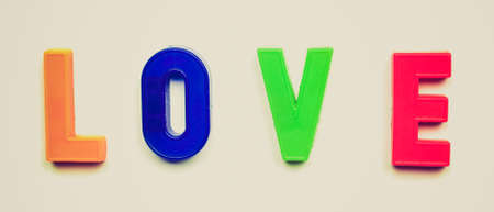 Vintage looking Love message written with plastic toy charactersの写真素材