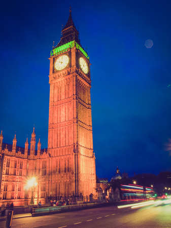 Vintage looking Big Ben Houses of Parliament Westminster Palace London gothic architecture - at nightの写真素材