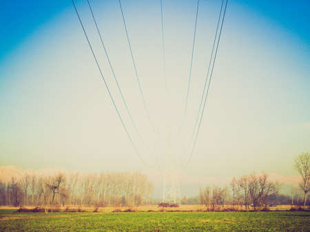 Vintage looking Electric transmission line tower mast with wiresの写真素材