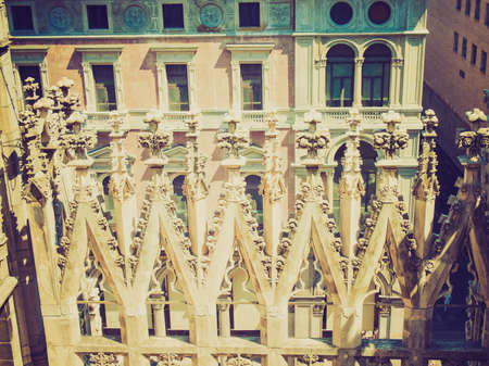 Vintage looking Duomo di Milano gothic cathedral church, Milan, Italyの写真素材