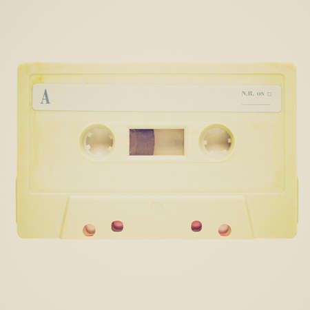 Vintage looking Magnetic tape cassette for audio music recording - isolated over white の写真素材
