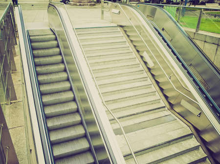 Vintage looking Escalator stairs to an underground station or supermarket