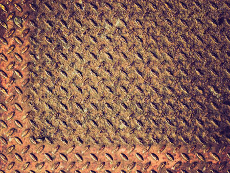 Vintage looking Rusted diamond steel plate useful as a background
