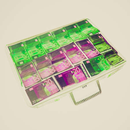 Vintage looking Money in a suitcase seen at X-ray airport checkの写真素材