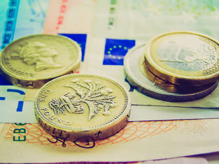 Vintage looking Detail of Euro and Pounds money currencyの写真素材