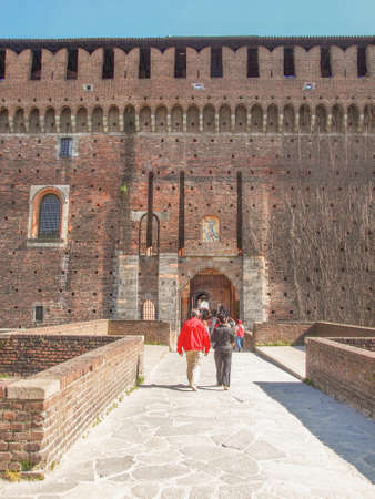 MILAN, ITALY - APRIL 10, 2014: People visiting the Sforza Castle aka Castello Sforzesco which is the oldest castle in townのeditorial素材