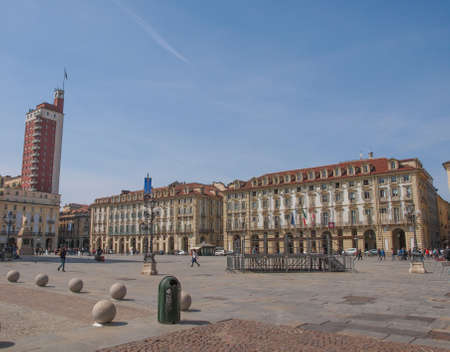 TURIN, ITALY - APRIL 09, 2014: Tourists visiting Piazza Castello, the central baroque square