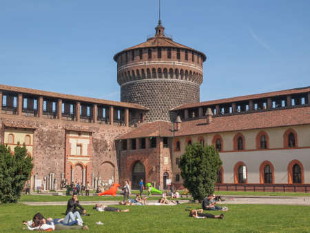 MILAN, ITALY - APRIL 10, 2014: People visiting the Sforza Castle aka Castello Sforzesco which is the oldest castle in townのeditorial素材