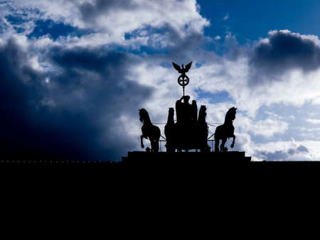 Sunset behind the Brandenburger Tor Brandenburg Gate in Berlin Germany seen as a silhouetteの写真素材