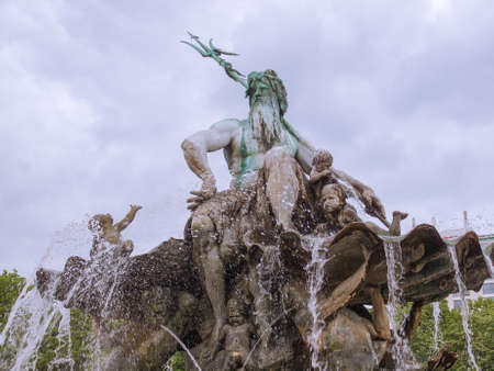 Neptunbrunnen Neptune fountain in Alexanderplatz square in Berlin Germanyの写真素材