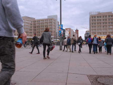 BERLIN, GERMANY - MAY 08, 2014: Turists visiting Alexander Platz, the central square in East Berlin, which was designed by German architect Peter Behrensのeditorial素材