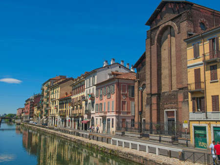 MILAN, ITALY - MAY 16, 2011: Tourists visiting the Naviglio Grande canal waterway in Milan Italyのeditorial素材