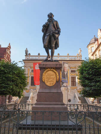 LEIPZIG, GERMANY - JUNE 12, 2014: The Goethe Denkmal monument to  Dichter J W von Goethe stands in the Naschmarkt square in front of the Old Stock Exchange since 1908のeditorial素材