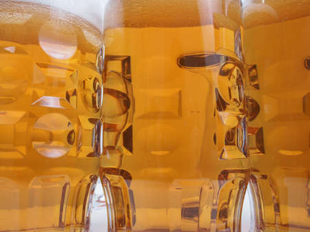 close up of many large glasses of German lager beerの写真素材