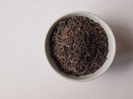 Loose tea leaves in a small bowlの写真素材