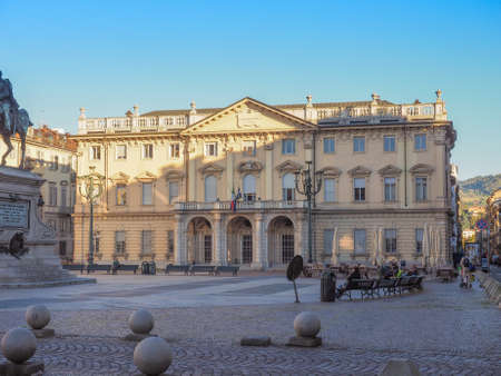 TURIN, ITALY - OCTOBER 22, 2014: People seated in front of Conservatorio Giuseppe Verdi music schoolのeditorial素材
