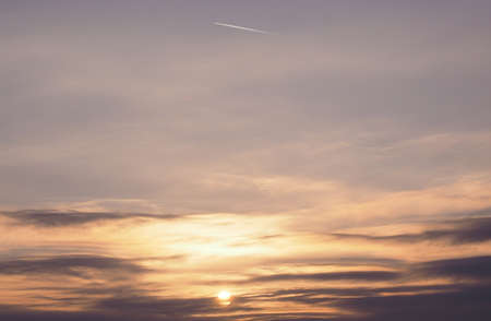 Sunset with plane in the sky