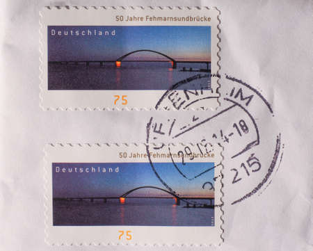 BERLIN, GERMANY - JANUARY 2, 2015: German stamp to celebrate 50 years since the construction of the Fehmarnsundbruecke bridgeのeditorial素材