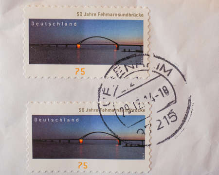 BERLIN, GERMANY - JANUARY 2, 2015: German stamp to celebrate 50 years since the construction of the Fehmarnsundbruecke bridgeのeditorial素材