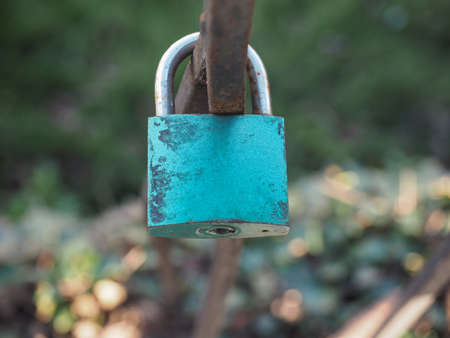 Love lock padlock sweethearts locked to a fence to symbolize eternal loveの写真素材