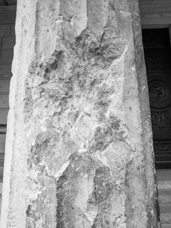 Column damaged by air raid bombing during WW2 in Berlin Museumsinsel in black and whiteの写真素材